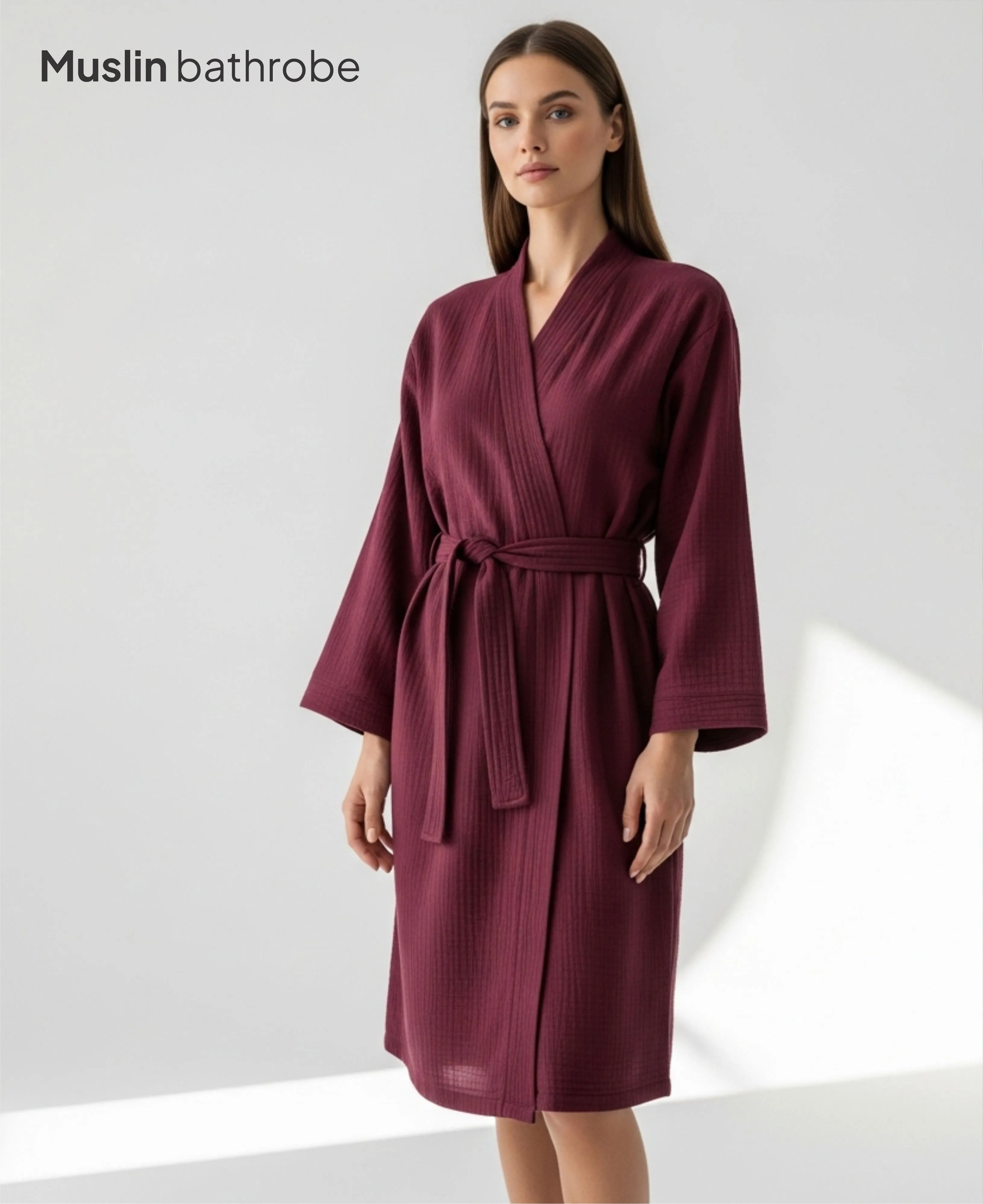 Person in bathrobe by doorway